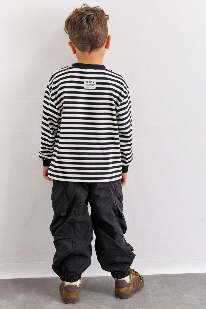 מכנסי ניילון עם כיסים וסיומת גומי | שחור