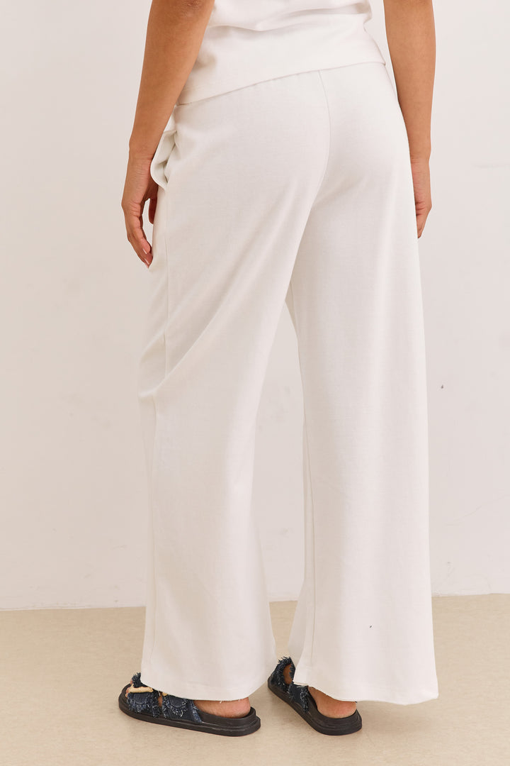 מכנסי אנוק סיומת גזורה | לבן