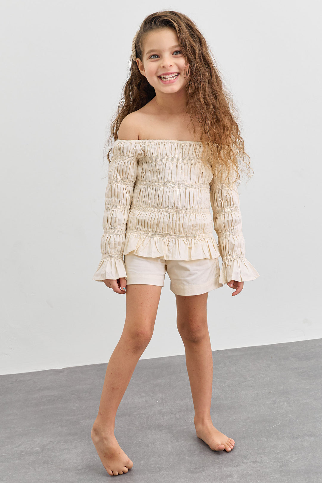 חליפת כיווצים טופ אוף שולדרס ושורטס | קרם