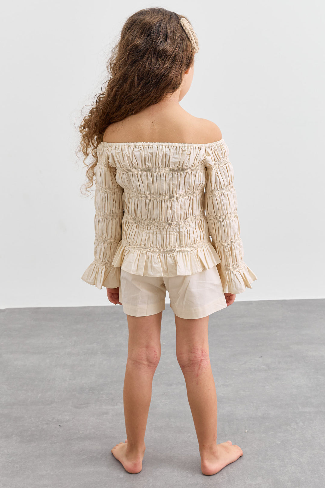 חליפת כיווצים טופ אוף שולדרס ושורטס | קרם