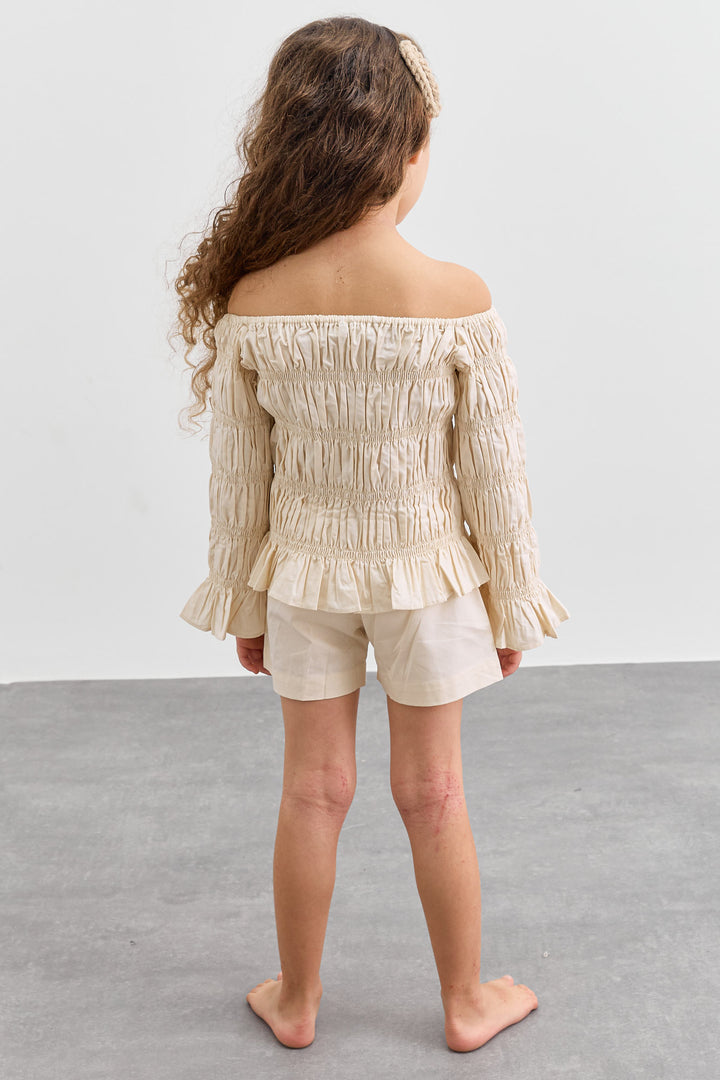 חליפת כיווצים טופ אוף שולדרס ושורטס | קרם