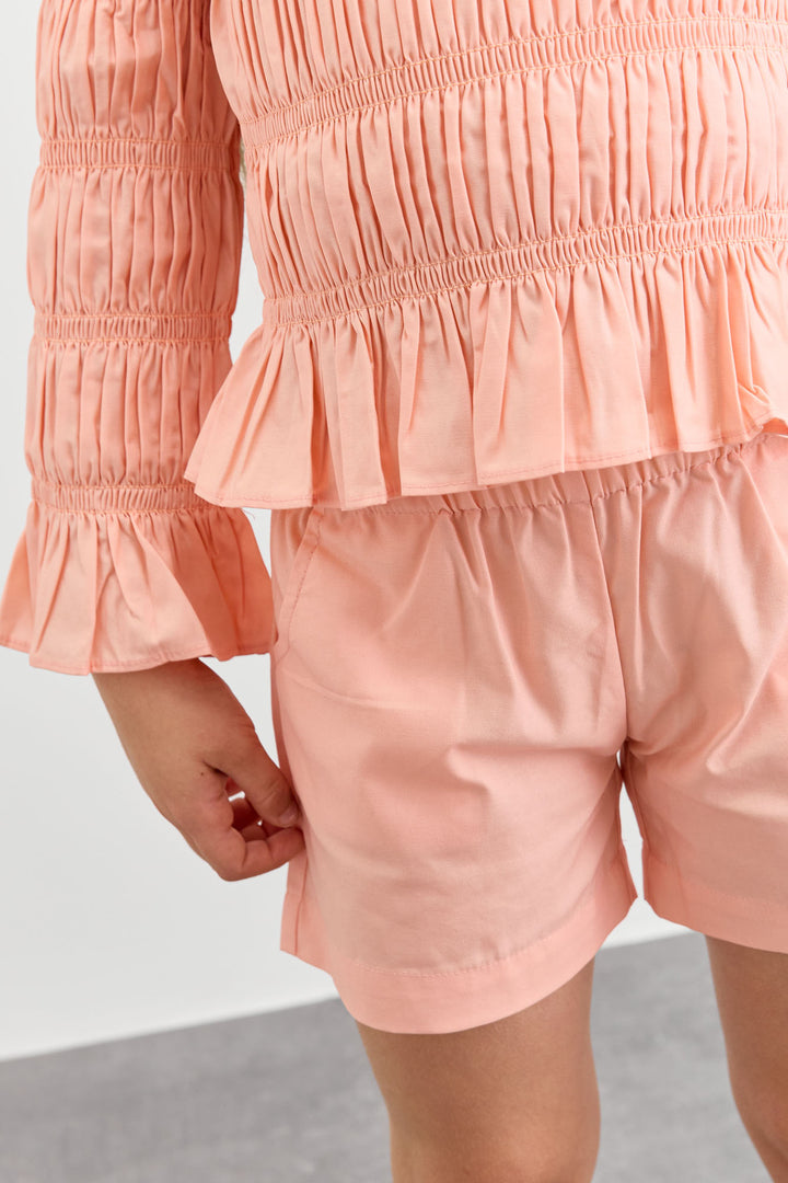 חליפת כיווצים טופ אוף שולדרס ושורטס | ורוד