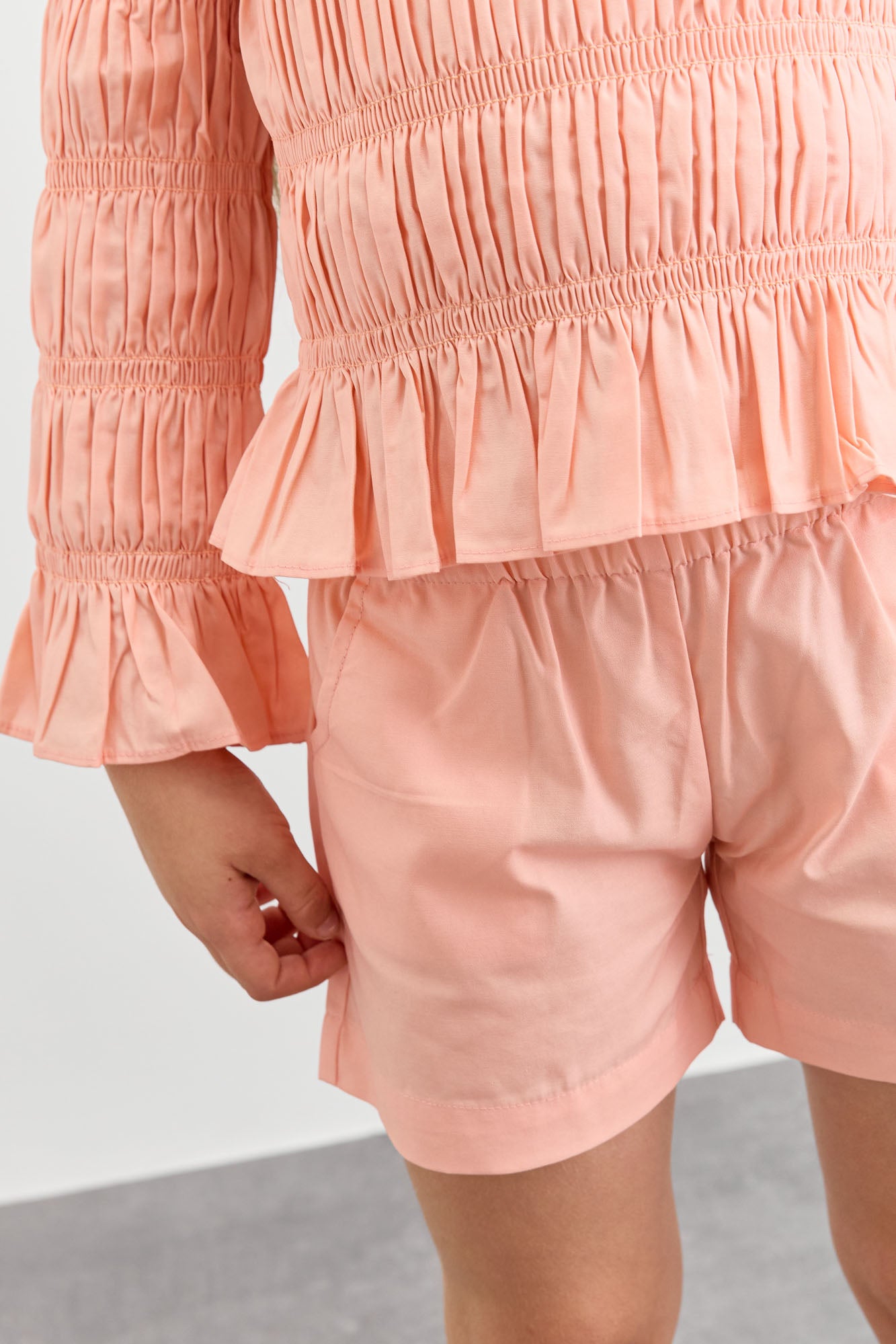 חליפת כיווצים טופ אוף שולדרס ושורטס | ורוד