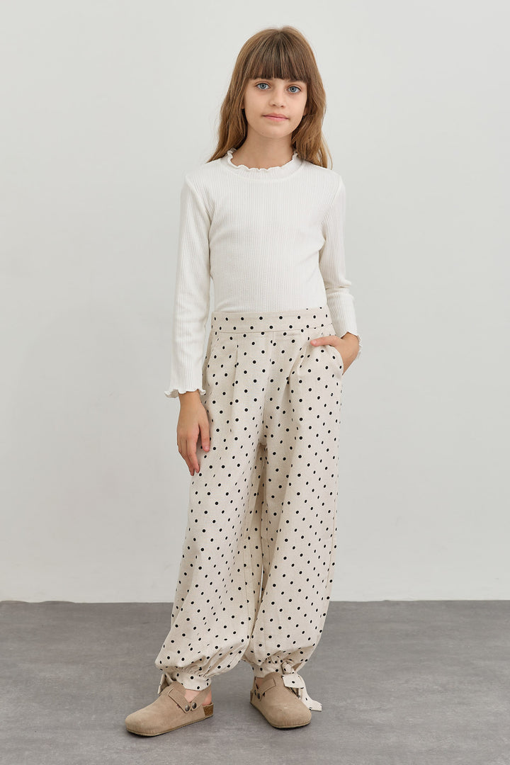 מכנסי בלון בגזרת אוברסייז פרינט נקודות | קרם